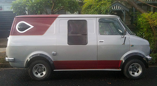 Chevrolet or GMC van with custom windows