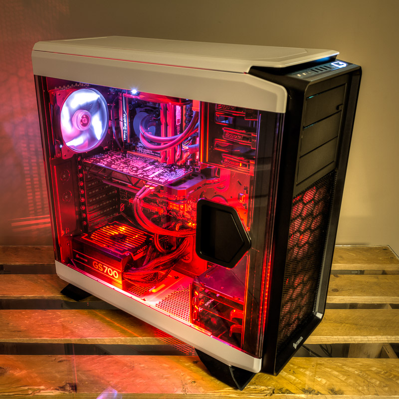 Side view of Corsair CC760T case, window side, powered up with red and white LEDs and fans